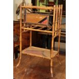 A Victorian painted faux bamboo magazine rack in the Aesthetic taste
