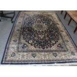 A machine made carpet of Oriental design, 284cm by 198cm
