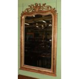 A Victorian giltwood rectangular form mirror with scroll and mask decorated pediment