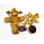 A 9 carat gold citrine bow pendant/brooch, measures 2cm by 3.5cm; a single amethyst earring