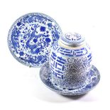 A pair of Chinese style blue and white printed chargers, dragon design; together with a large blue