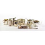 A quantity of silver condiment items, including: three various cream-jugs, Birmingham, 1903,1909,