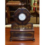 ~ A regency style rosewood brass inlaid mantel timepiece