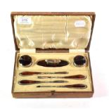 A Stokes & Ireland Ltd silver and tortoiseshell manicure set, Chester 1927, in original case (