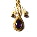 A 9 carat gold amethyst and seed pearl pendant on chain, stamped '375', pendant length 3.2cm,