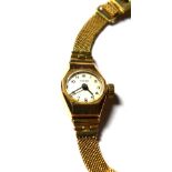 A lady's 9 carat Talis wristwatch on mesh strap, stamped