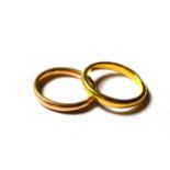 A 22 carat gold band ring, finger size R; and a 9 carat gold band ring, finger size N (2). 22