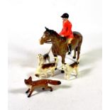Beswick Huntsman (Style Two: Standing), model No.1501, brown gloss, with a fox and three hounds (5)