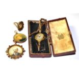Two picture lockets; a 9 carat gold smokey quartz ring, finger size M; and a lady's wristwatch on