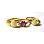 A 9 carat gold ruby and diamond cluster ring, finger size O1/2; an 18 carat gold opal solitaire