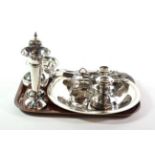 A group of assorted silver including a caster; a toast rack; a bud vase; an Egyptian plate; and