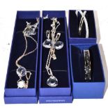 Two Swarovski necklace and earring suites and two Swarovski bangles, all boxed