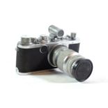 A Leica camera and 135mm lens