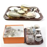 A quantity of silver-mounted dressing-table jars and other dressing table items, including: three