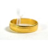 An 18 carat gold band ring, out of shape. Gross weight 3.63 grams.