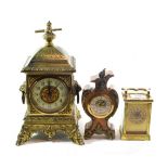 A gilt metal mantel timepiece; a brass carriage timepiece; and a modern timepiece (3)