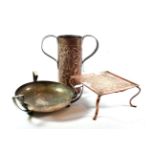 Three pieces of Arts & Crafts metalware including a three handled bowl possibly Keswick School of