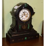 A Victorian black slate and malachite set striking mantel clock, enamel dial with recessed centre