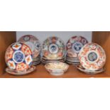 A quantity of 19th century and later Japanese Imari plates and bowls