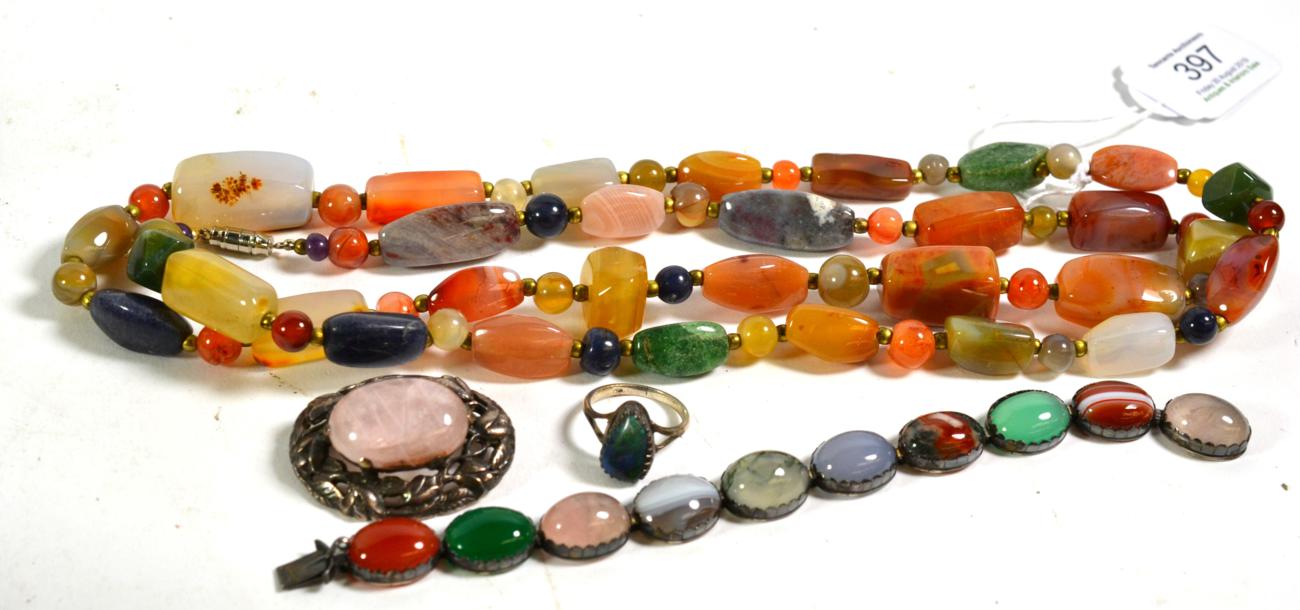 A hardstone necklace, length 97cm; an opal ring, unmarked, finger size N1/2; a quartz brooch, length