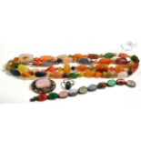 A hardstone necklace, length 97cm; an opal ring, unmarked, finger size N1/2; a quartz brooch, length