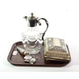 A collection of white metal including a claret jug, ceylon box, scent bottle, cigar cutter and a