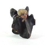 A 19th century painted and carved horse vertebrae in the form of John Wesley
