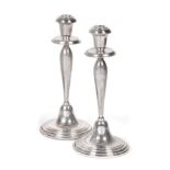 A Pair of Silver Candlesticks, with English import marks for Birmingham, 1998, on stepped circular