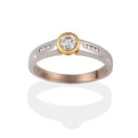 An 18 Carat Gold Diamond Ring, a round brilliant cut diamond in a yellow rubbed over setting, to