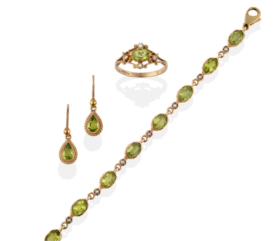 A Peridot and Seed Pearl Bracelet, the stones in crimped settings alternate along the length of