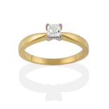An 18 Carat Gold Diamond Solitaire Ring, the princess cut diamond in a white four claw setting on
