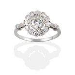 An 18 Carat White Gold Diamond Cluster Ring, the round brilliant cut diamonds in millegrain