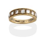 A Diamond Half Hoop Ring, nine graduated round brilliant cut diamonds in yellow claw settings with