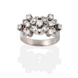 A Diamond Cluster Ring, comprised of two flower heads set with round brilliant cut diamonds and