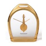 A Brass Stirrup Shaped Mantel Timepiece, signed Jaeger LeCoultre, 20th century, glazed panels with a
