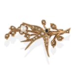 A 9 Carat Gold Seed Pearl and Sapphire Swallow Brooch, realistically modelled in flight with a