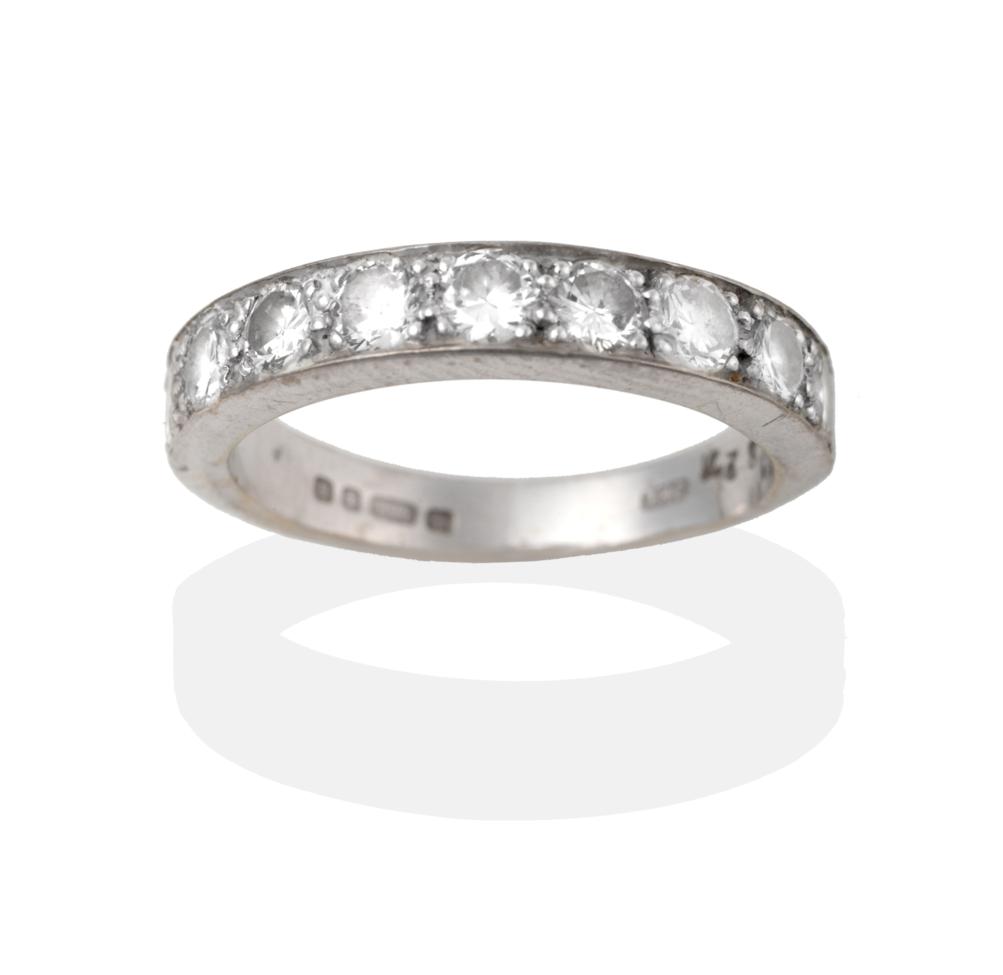 An 18 Carat White Gold Diamond Half Hoop Ring, nine round brilliant cut diamonds in white claw