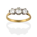 An 18 Carat Gold Diamond Three Stone Ring, the old brilliant cut diamonds in a white claw setting to