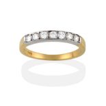 An 18 Carat Gold Half Hoop Ring, seven round brilliant cut diamonds in white claws within a flat