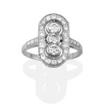 An Art Deco Style Diamond Cluster Ring, a trio of round brilliant cut diamonds in white collet