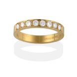 An 18 Carat Gold Diamond Half Hoop Ring, eight round brilliant cut diamonds in yellow claws within a
