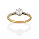 An Early 20th Century Diamond Solitaire Ring, the old cut diamond in a white claw setting, to