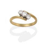 An 18 Carat Gold Diamond Three Stone Twist Ring, the round brilliant cut diamonds in white claw