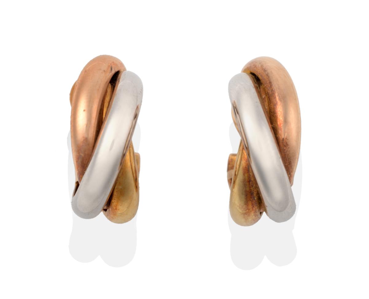 A Pair of Trinity Hoop Earrings, by Cartier, three entwined bands of yellow, rose and white metal,