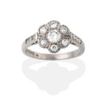 A Palladium Diamond Cluster Ring, the round brilliant cut diamonds in white claw settings, to