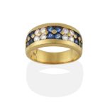 A Sapphire and Diamond Ring, alternating clusters of four round cut sapphires and four round