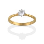 An 18 Carat Gold Diamond Solitaire Ring, the round brilliant cut diamond in white claws on a