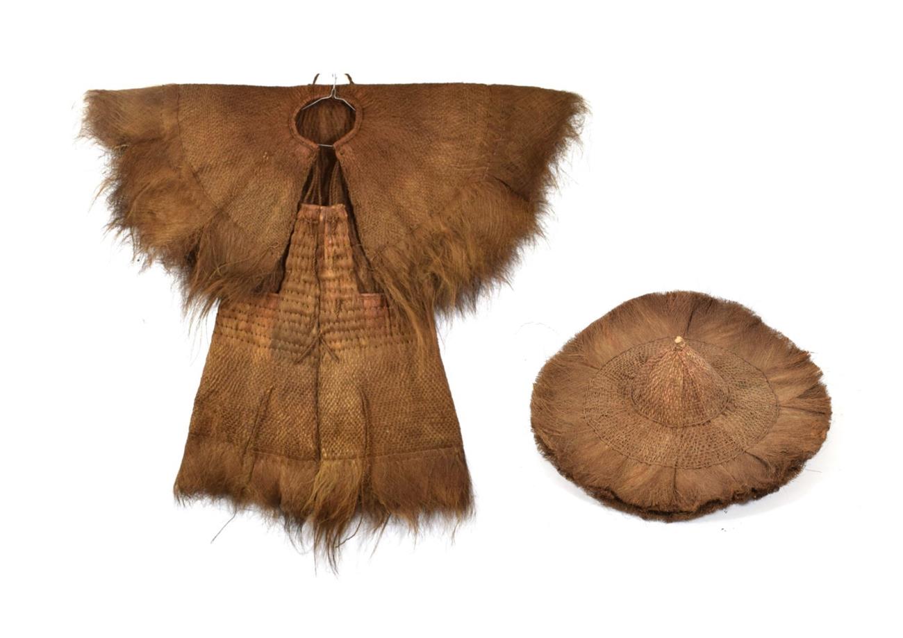 A 19th/20th Century Polynesian/Indonesian Jacket, of woven palm fibre, with rolled neckline and