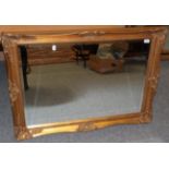 A Reproduction Gilt Bevelled Glass Mirror, 76cm by 106cm