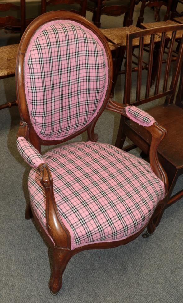 A 19th century walnut framed open armchair, recovered in pink tartan fabric